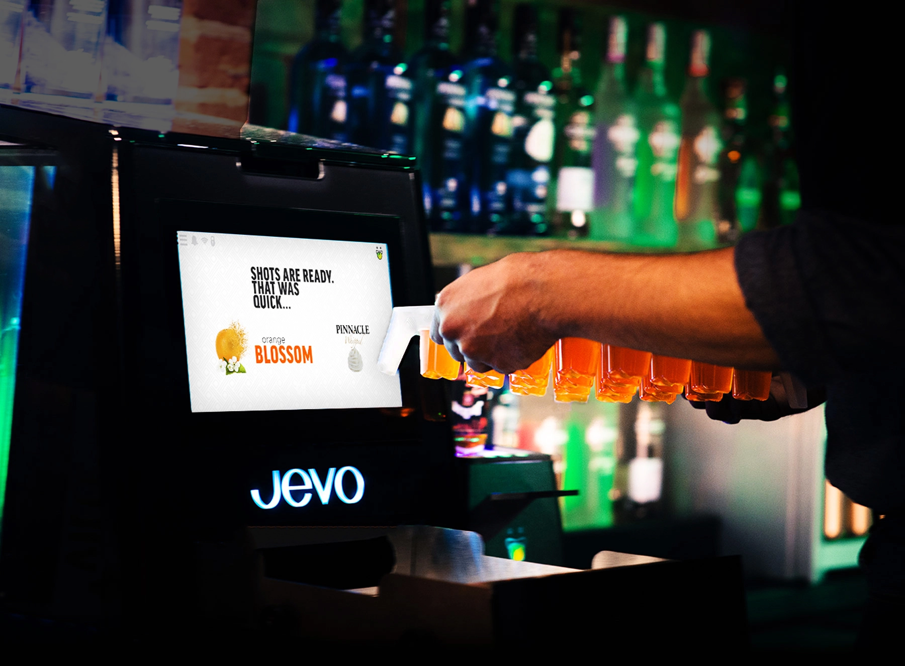 Photo of a Jevo shot maker in a bar